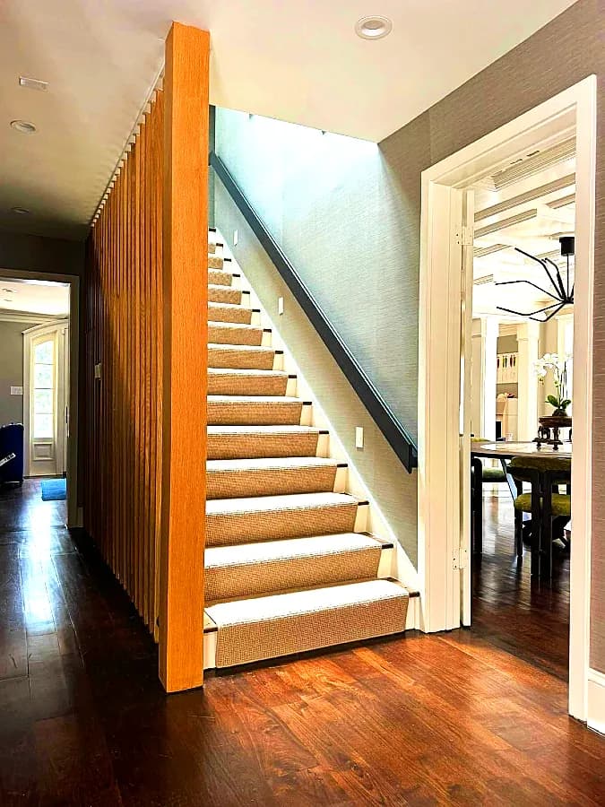 Custom wooden slat staircase and finish carpentry by Andrade Custom Trim